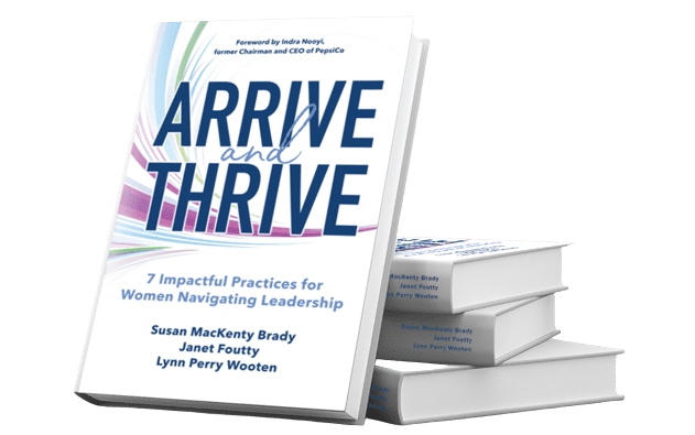 arrive and thrive stacked books